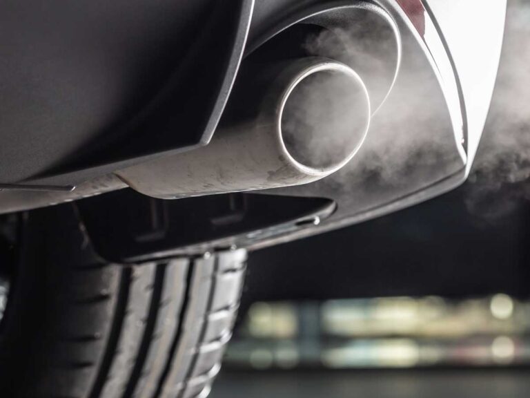 enlarged view of a car exhaust blowing out car fumes