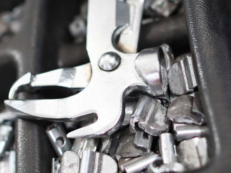 close up view of weights and pliers used for wheel balancing